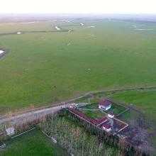 South east area of Anzali Wetland. Keshurud River,pasture (seasonal wetland) and reed bed of Chokum Wildlife Refuge are seen. The building with red roof is Anzali Wetland Eco Tourism Center. 