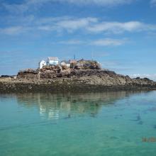 View of La Marmotière, one of four rocky heads within Les Écrehous & Les Dirouilles Ramsar Site that are large enough to support buildings