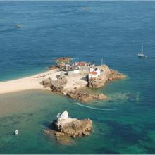 Aerial view of La Marmotière, one of four rocky heads within Les Écrehous & Les Dirouilles Ramsar Site that are large enough to support buildings